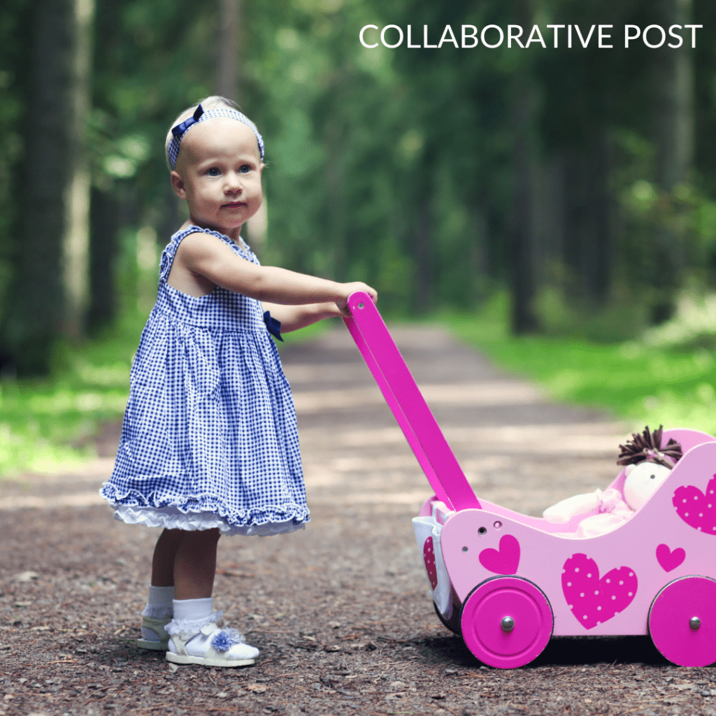 little girl with dolls pram